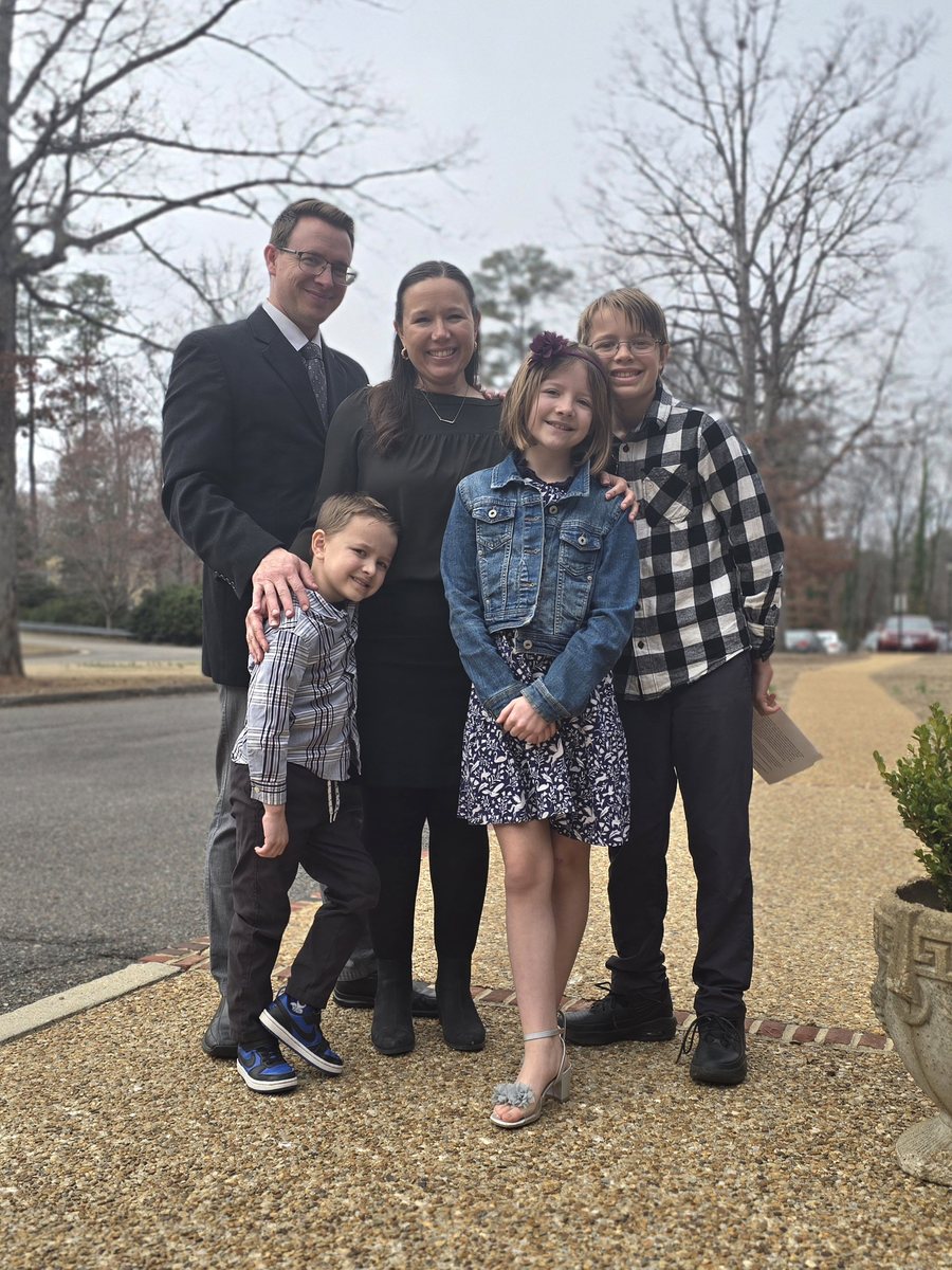 The Granger family standing together outdoors